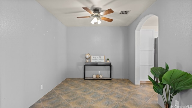 spare room with ceiling fan