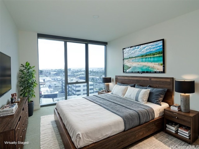 carpeted bedroom with access to outside and floor to ceiling windows