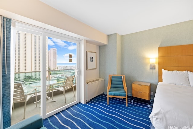 bedroom featuring radiator heating unit and dark carpet