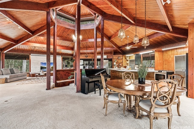 carpeted dining area featuring lofted ceiling with beams, wood ceiling, and wood walls