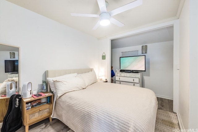 bedroom with ceiling fan and wood-type flooring