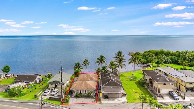 birds eye view of property with a water view