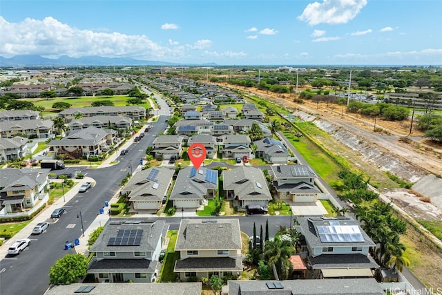 birds eye view of property with a mountain view