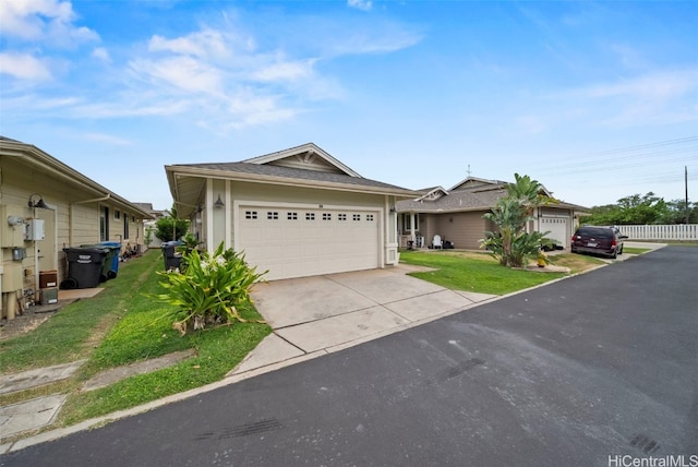 single story home featuring a garage and a front lawn