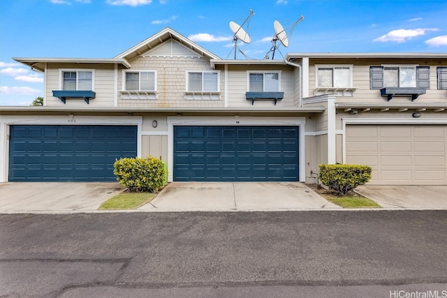 townhome / multi-family property featuring a garage