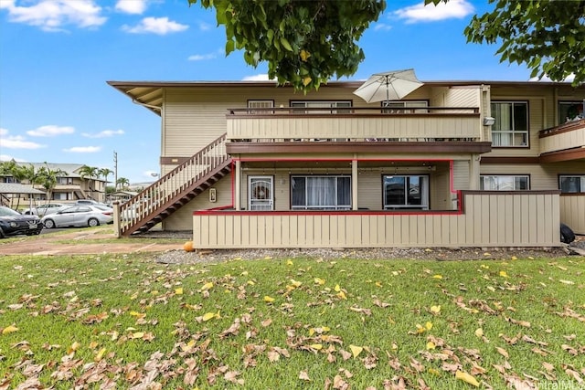 view of side of home featuring a lawn