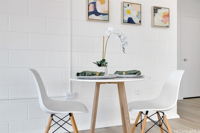 dining space featuring hardwood / wood-style flooring