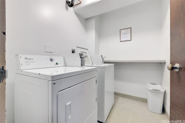 clothes washing area featuring washing machine and clothes dryer