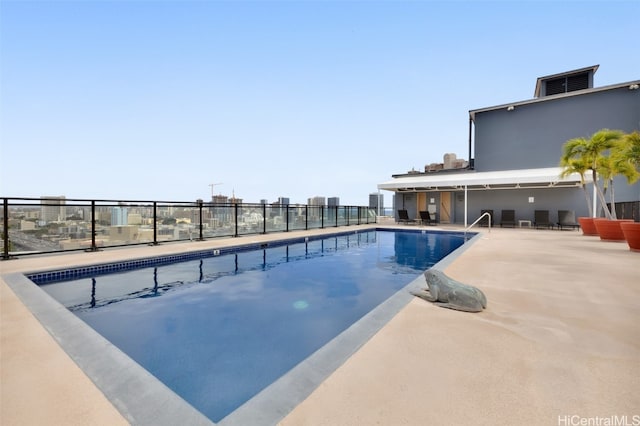 view of swimming pool with a patio area