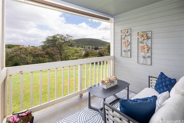 balcony featuring a mountain view