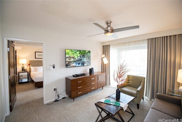 living room with light carpet and ceiling fan