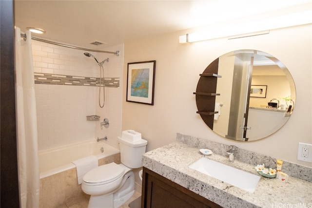 full bathroom featuring toilet, shower / bath combo with shower curtain, and vanity