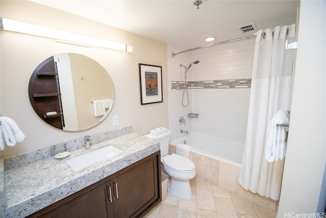 full bathroom featuring vanity, shower / bath combination with curtain, toilet, and tile patterned floors