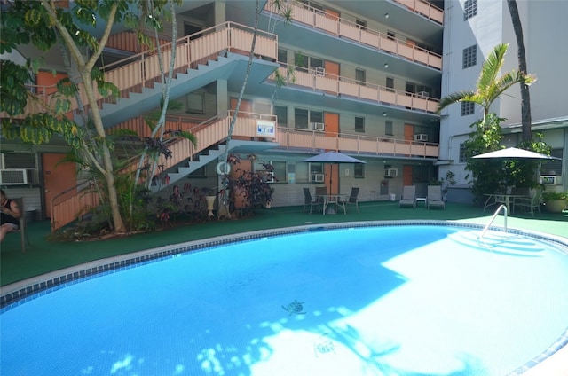 view of swimming pool featuring a patio area