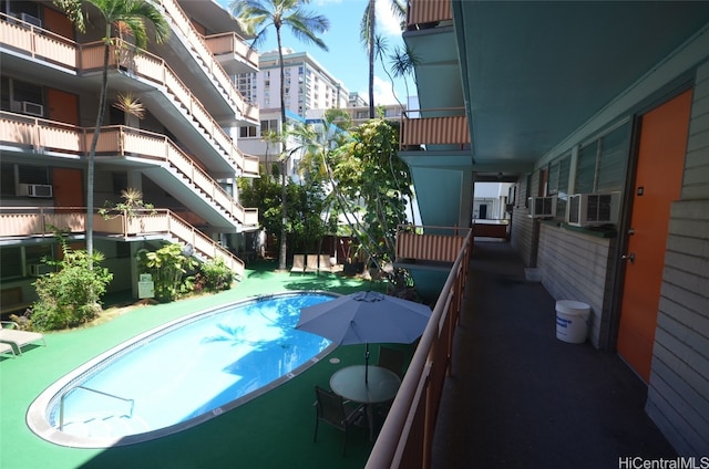 view of pool featuring cooling unit