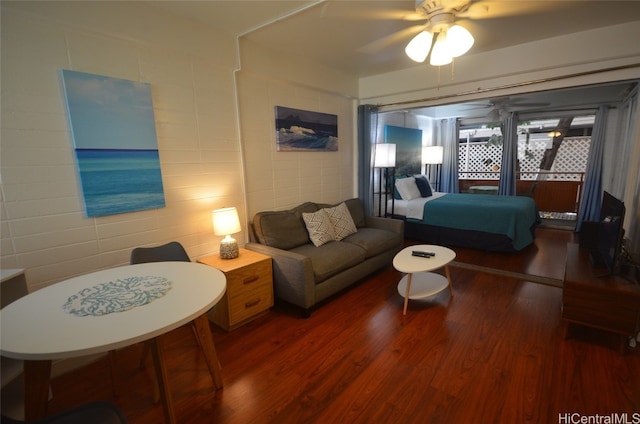 bedroom with dark wood-type flooring and ceiling fan