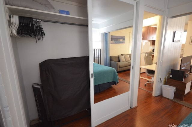 bedroom featuring a closet and wood-type flooring