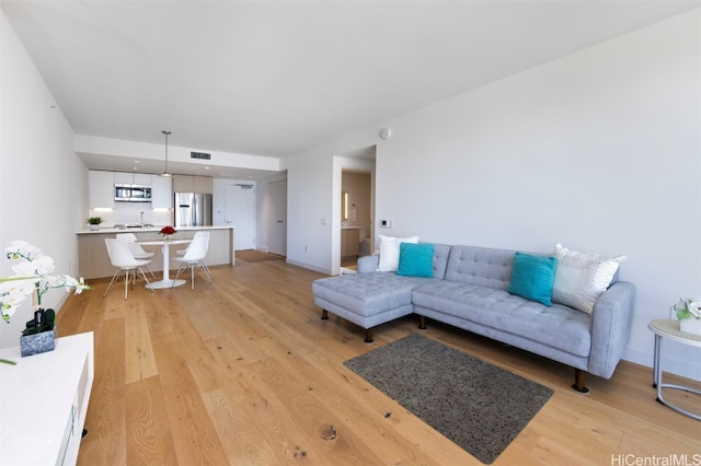 living room with light hardwood / wood-style floors