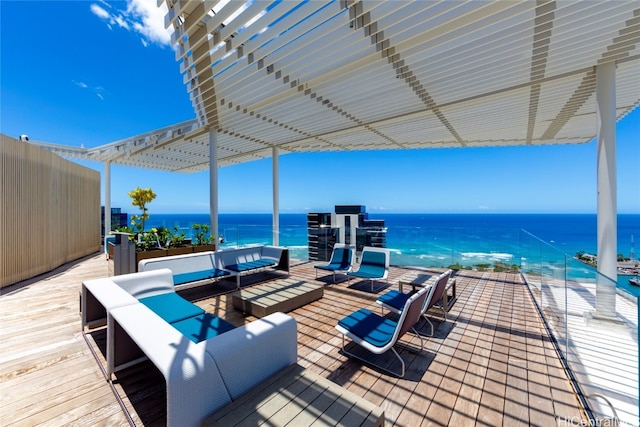 wooden deck with outdoor lounge area and a water view