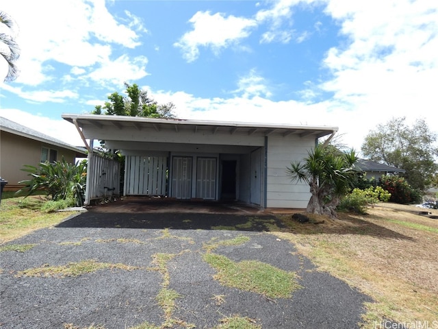 view of front of property with a carport