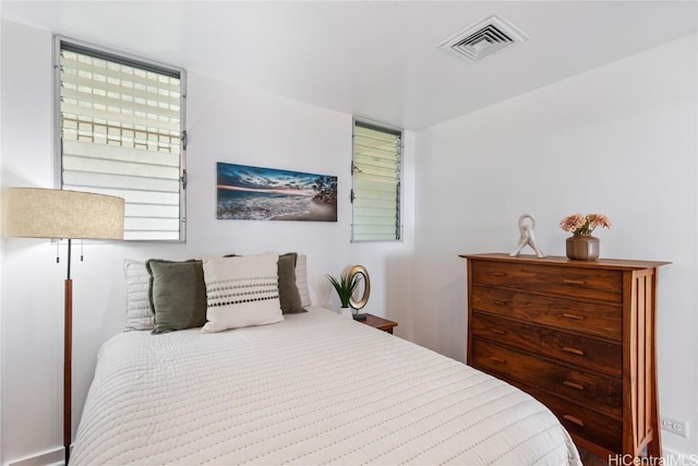 bedroom featuring visible vents