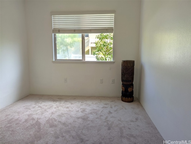 empty room with light colored carpet