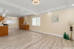 interior space featuring light hardwood / wood-style floors and crown molding