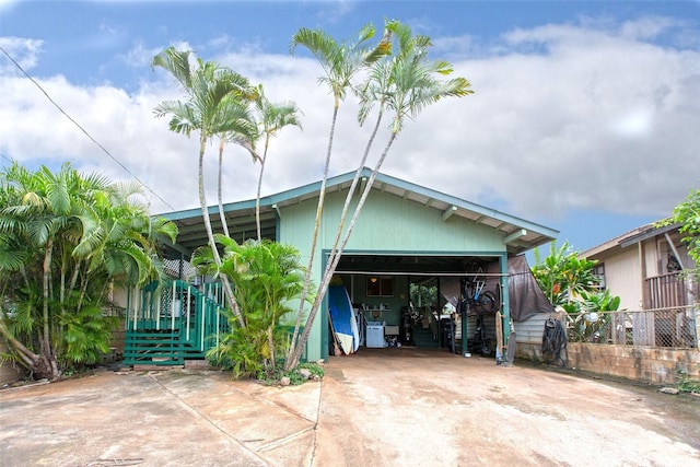 66-839 Kamakahala St, Waialua, HI 96791 - view of front of house featuring driveway, a garage, and fence