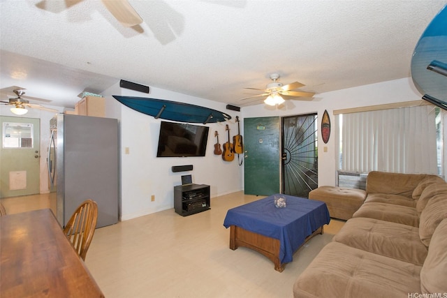 66-839 Kamakahala St, Waialua, HI 96791 - living area featuring a ceiling fan and a textured ceiling