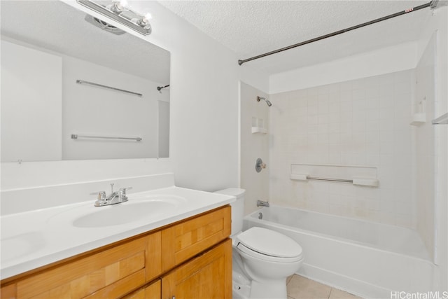 full bathroom featuring tile patterned floors, vanity, a textured ceiling, toilet, and tiled shower / bath