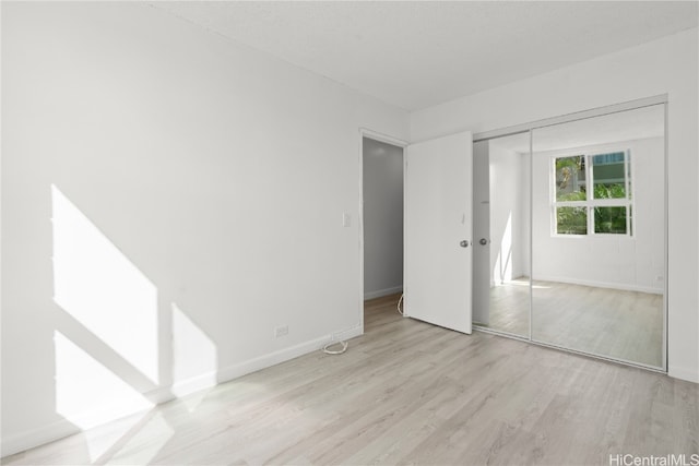 unfurnished room featuring light wood-type flooring