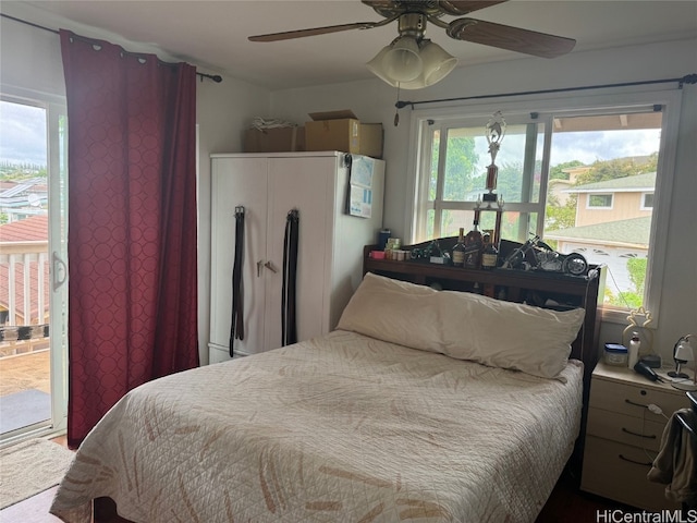 bedroom featuring ceiling fan and access to outside