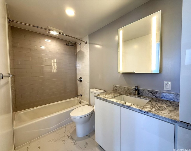 bathroom featuring vanity, marble finish floor, bathing tub / shower combination, and toilet