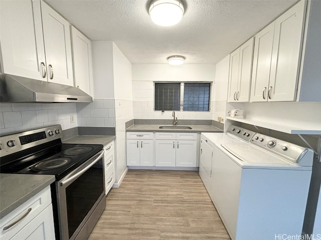 kitchen with electric range, white cabinetry, light wood-type flooring, sink, and washer and clothes dryer