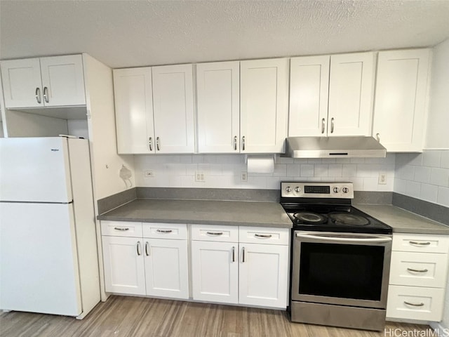 kitchen featuring electric range, light hardwood / wood-style flooring, white cabinetry, and white refrigerator