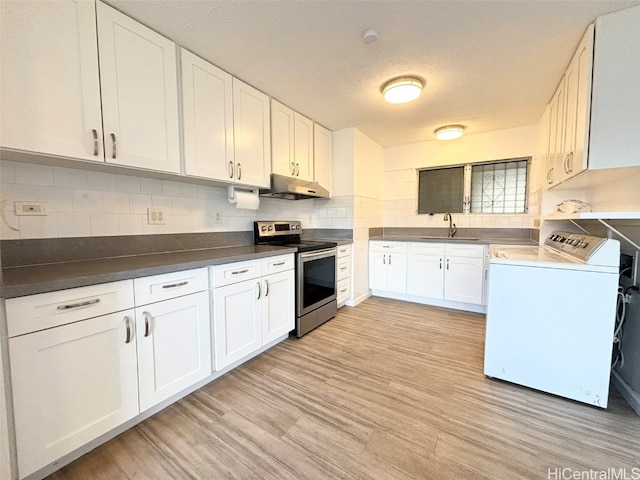 kitchen featuring sink, backsplash, stainless steel range with electric stovetop, light hardwood / wood-style floors, and white cabinets