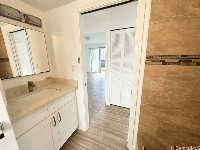 bathroom featuring vanity and hardwood / wood-style floors