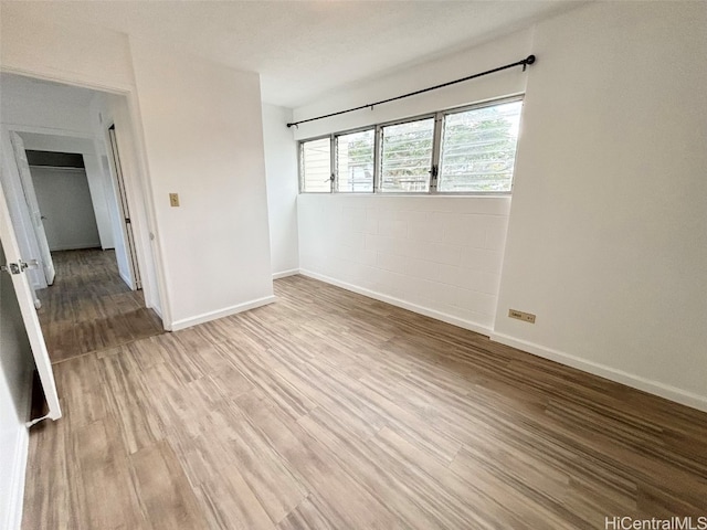 unfurnished room with light hardwood / wood-style flooring