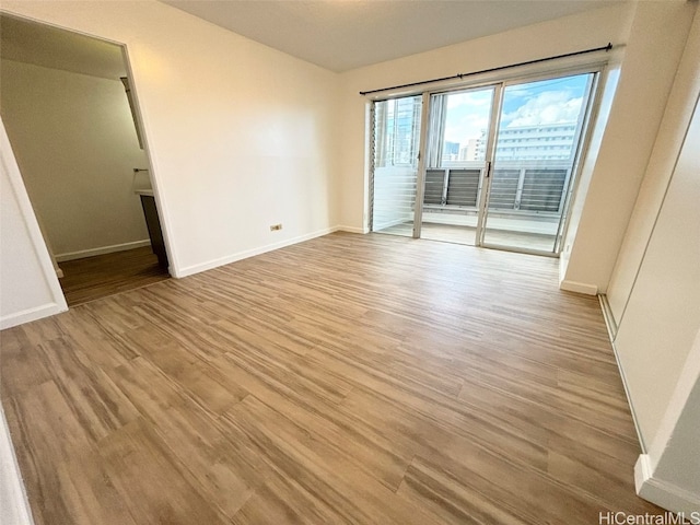 empty room with light hardwood / wood-style floors