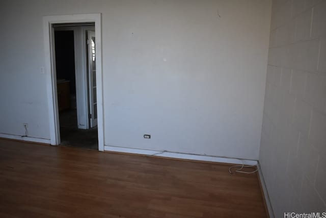 unfurnished room with dark hardwood / wood-style floors