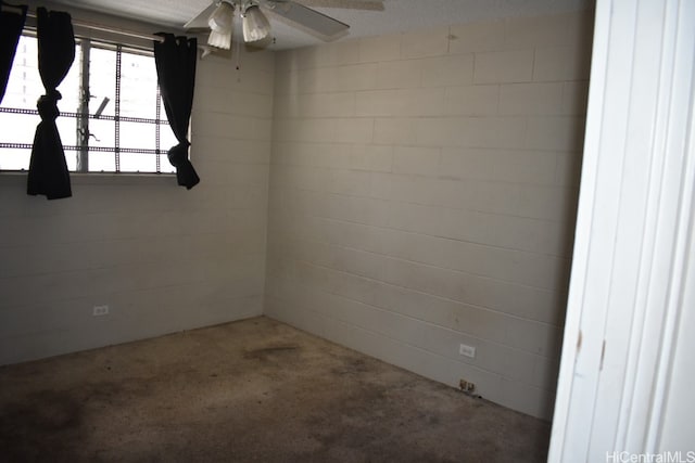 unfurnished room featuring a textured ceiling and ceiling fan