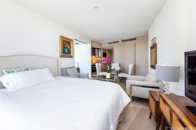 bedroom with wood finished floors