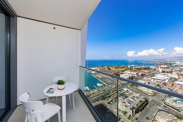 balcony featuring a view of city and a water view