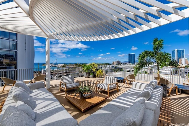 view of patio with an outdoor hangout area, a city view, a water view, and a pergola