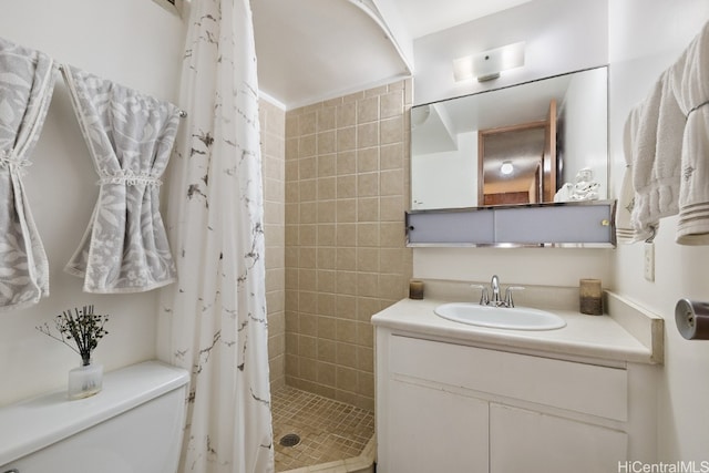 bathroom with vanity, toilet, and a shower with curtain