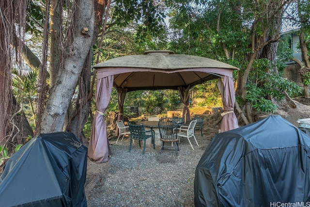 view of patio / terrace featuring a gazebo and a grill