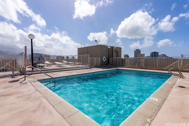 view of swimming pool featuring a patio