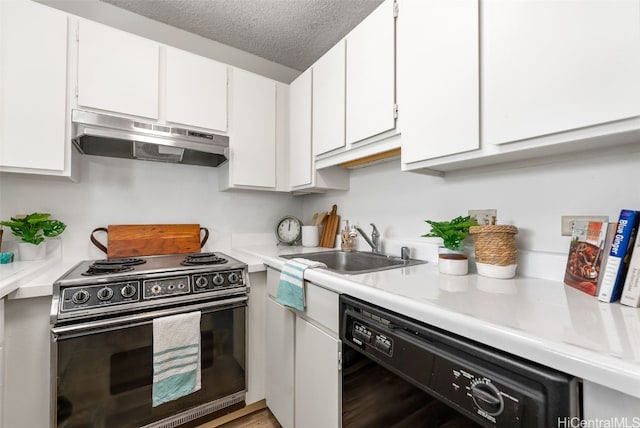 kitchen featuring white cabinetry, black dishwasher, sink, and stainless steel stove