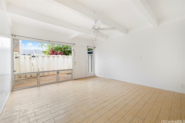 spare room featuring beamed ceiling, light wood-type flooring, and ceiling fan