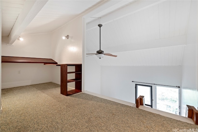 additional living space featuring carpet floors, lofted ceiling with beams, and ceiling fan